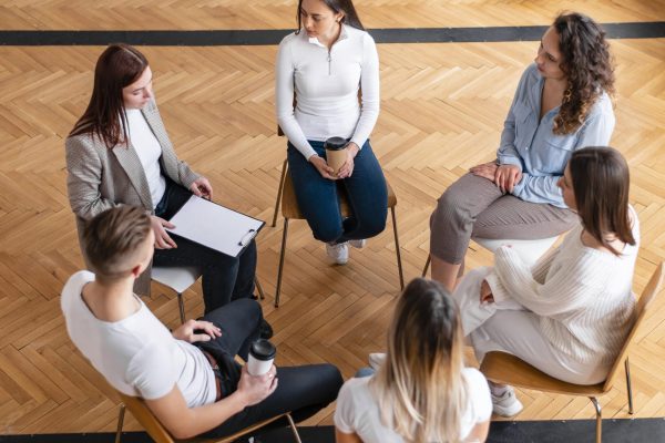medium-shot-people-sitting-circle-scaled medium-shot-people-sitting-circle-scaled